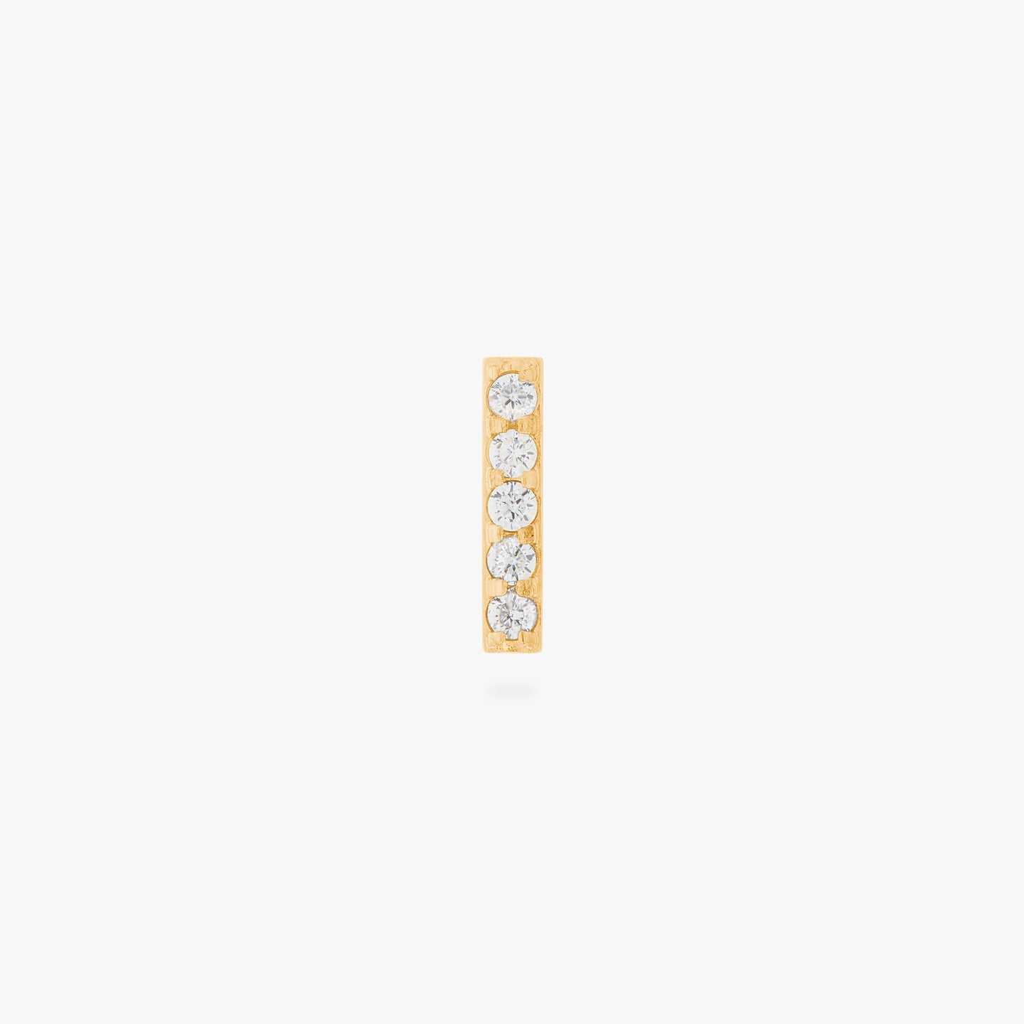 This is an image of a gold/clear bar that has 5 mini CZs in a line formation with a gold labret with a circle disc and the 