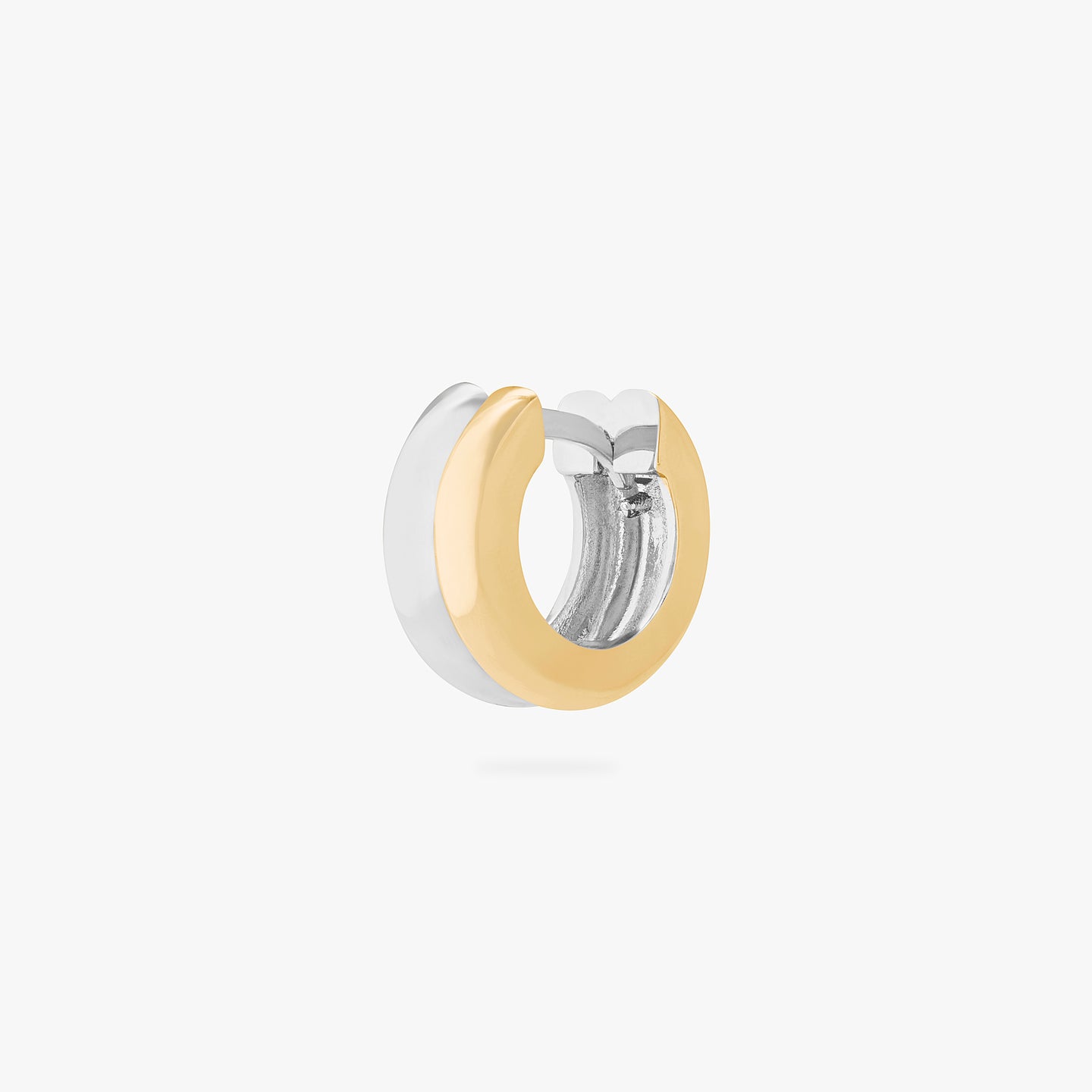 A chunky huggie that is two-toned gold and silver. color:null|gold/silver