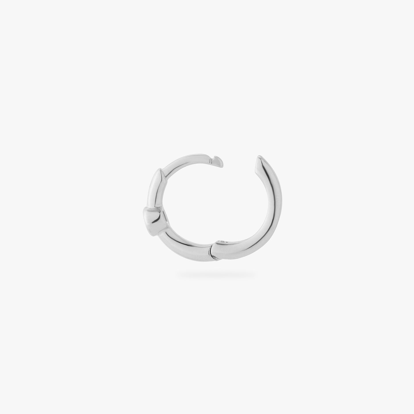 a silver small slim huggie with a clear cz bezel color:null|silver/clear