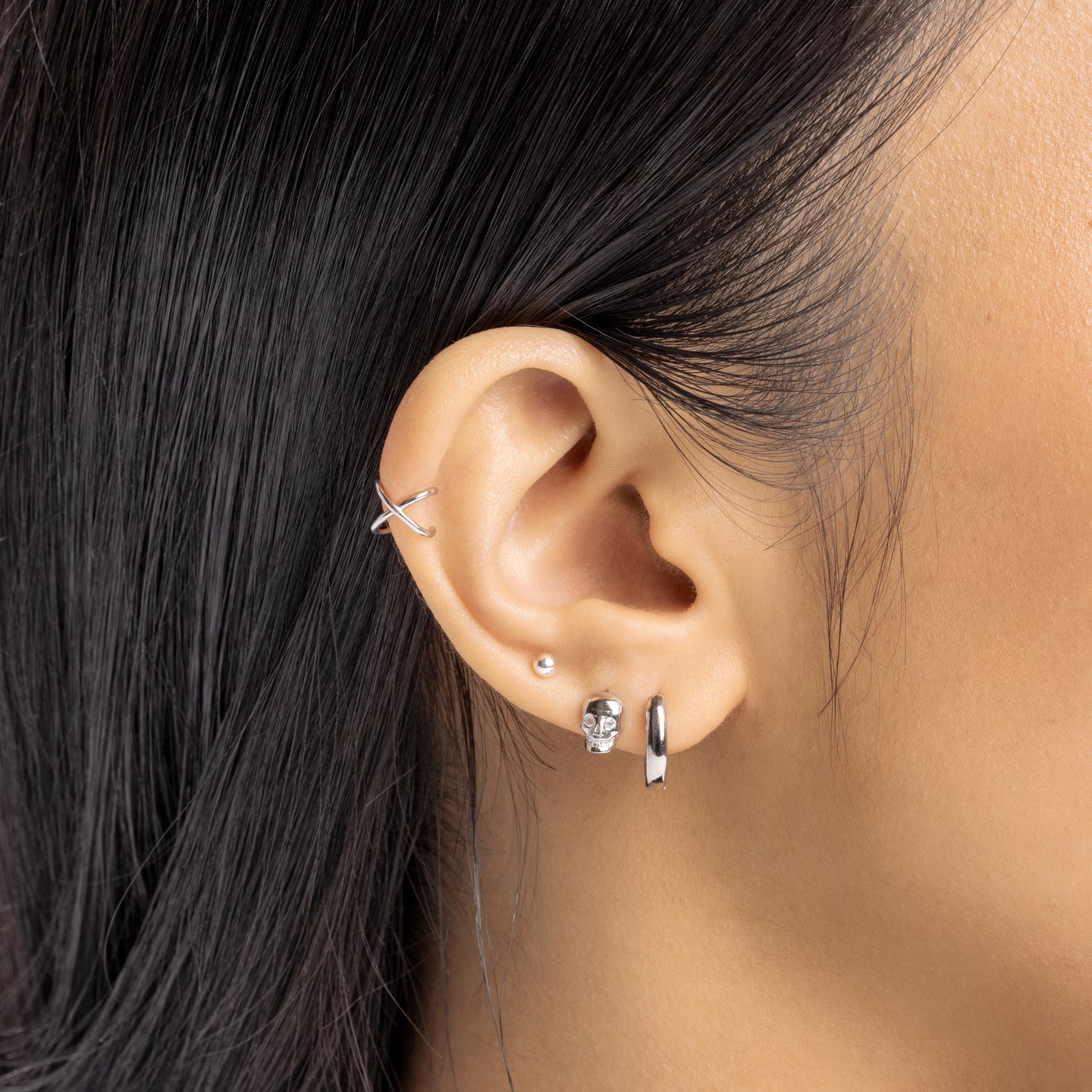 This is a silver ear cuff with a twisted detail [hover] color:silver