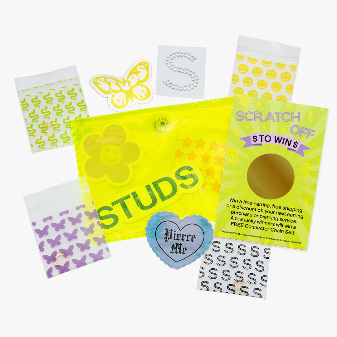 A yellow gift pouch with stickers and a studs scratch-off. Perfect for gifting! [hover] color:null|yellow