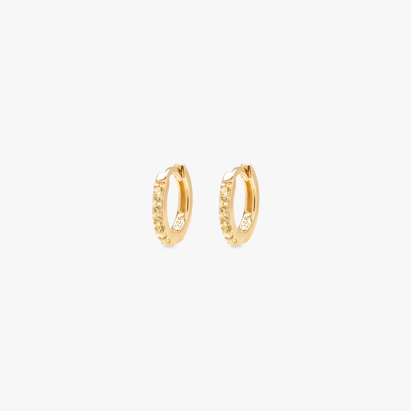 Miniature pavé huggie in gold with yellow gems. [pair] color:gold/yellow