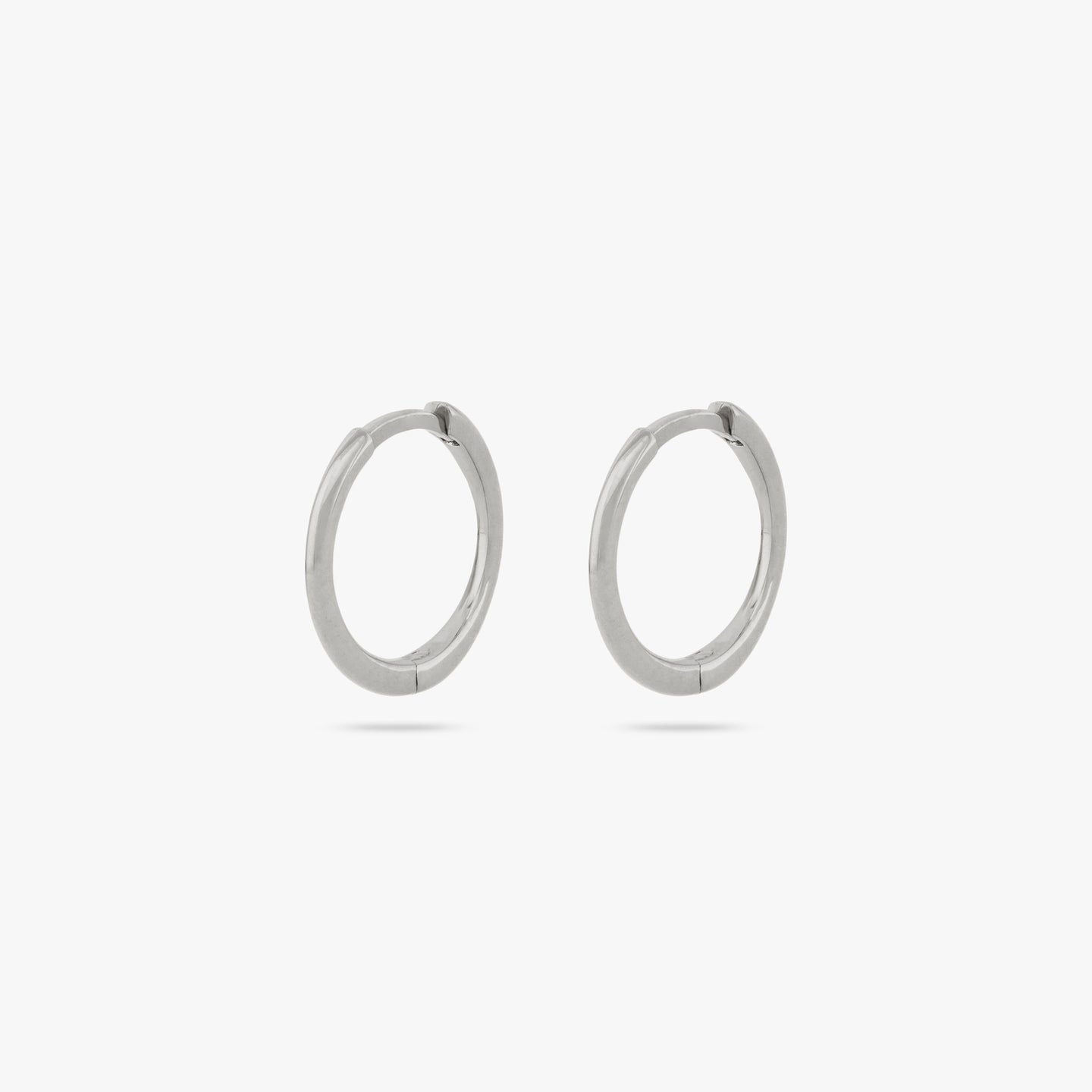 Pair of small slim silver hoops. [pair] color:null|silver