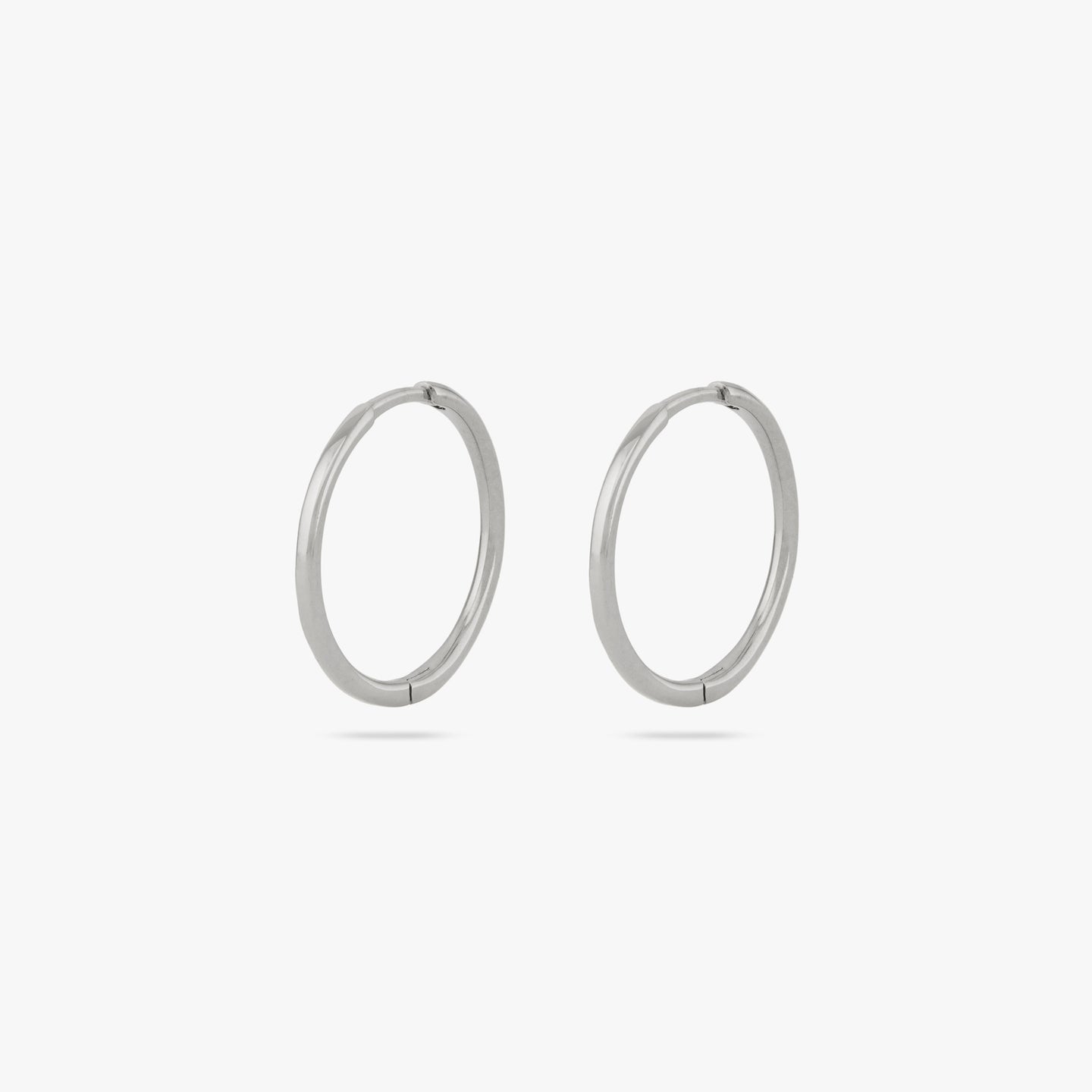 Pair of medium sized slim simple silver hoop. [pair] color:null|silver
