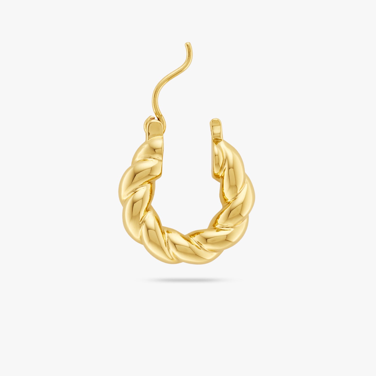 This is a small gold hoop with a twisted detail and the clasp opened color:null|gold