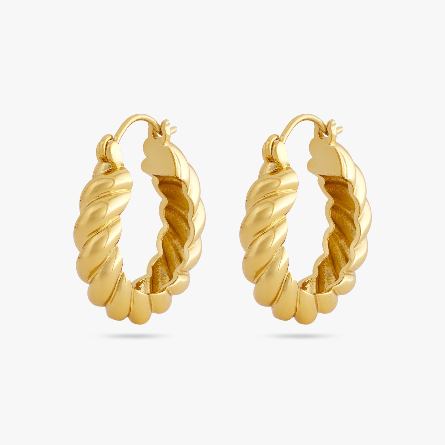 A medium sized gold hoop with french twist detailing [pair] color:null|gold