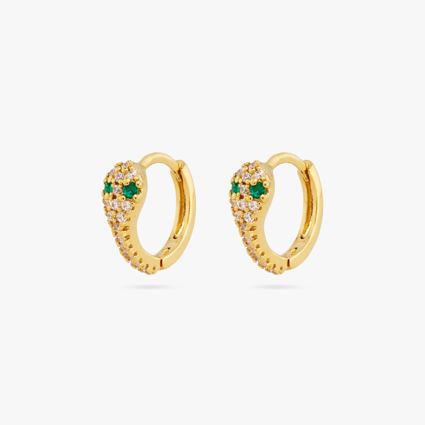 This is a pair of gold, pave lined and serpent shaped huggie earrings with green CZ eyes [pair] color:null|gold/clear