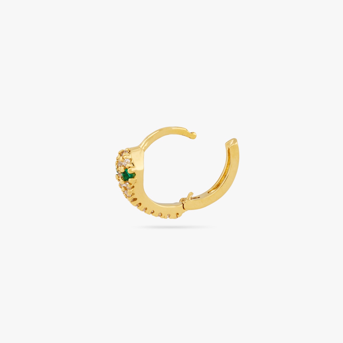 This is a gold, pave lined and serpent shaped huggie earring with green CZ eyes and its clasp undone color:null|gold/clear
