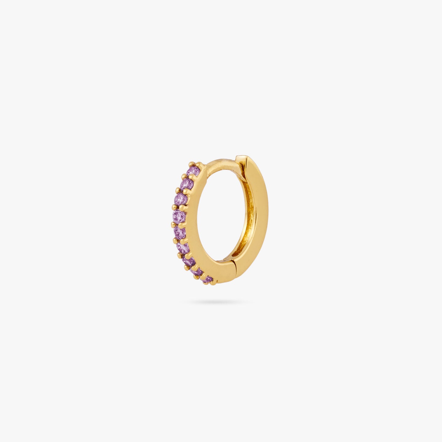 A mini gold huggie lined with purple cz gems on the front color:null|gold/purple