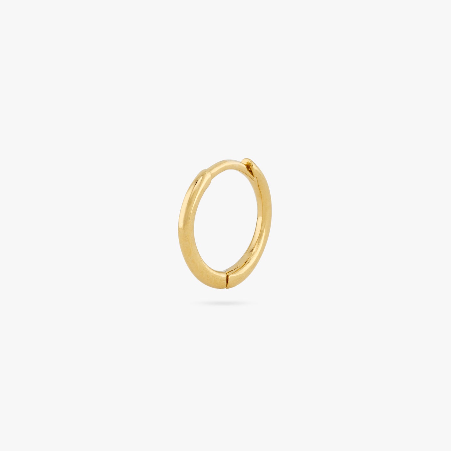 Small slim gold huggie. color:null|gold