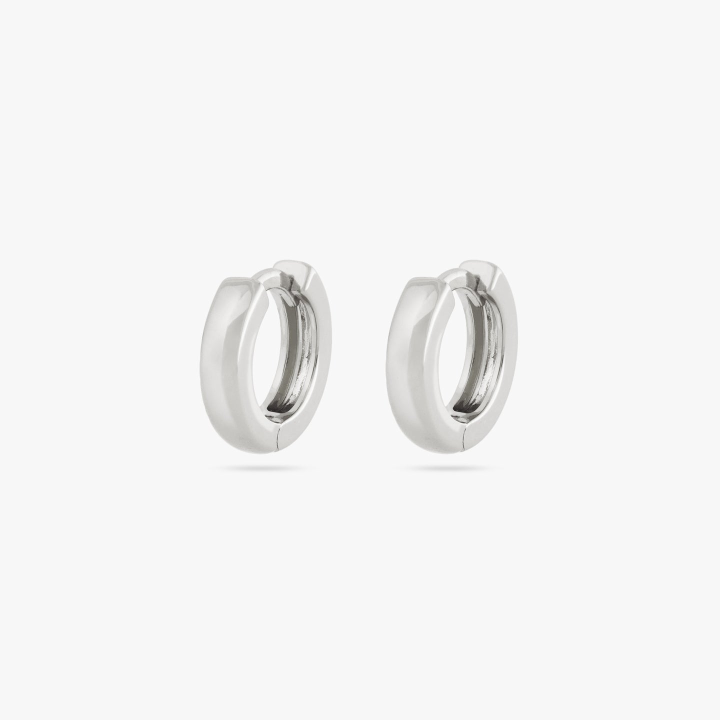 Pair of mini sized chunky silver huggies. [pair] color:null|silver