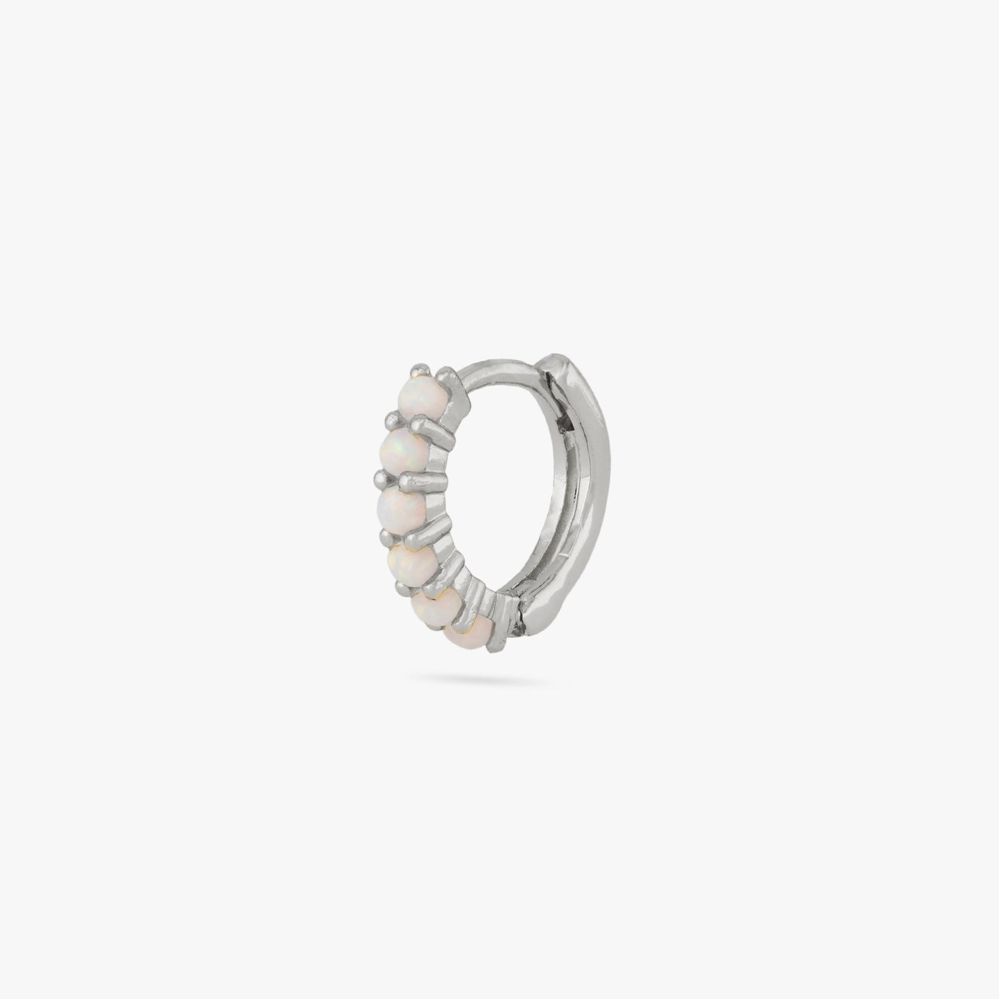 This is a silver huggie with large opal pavé color:null|silver/opal