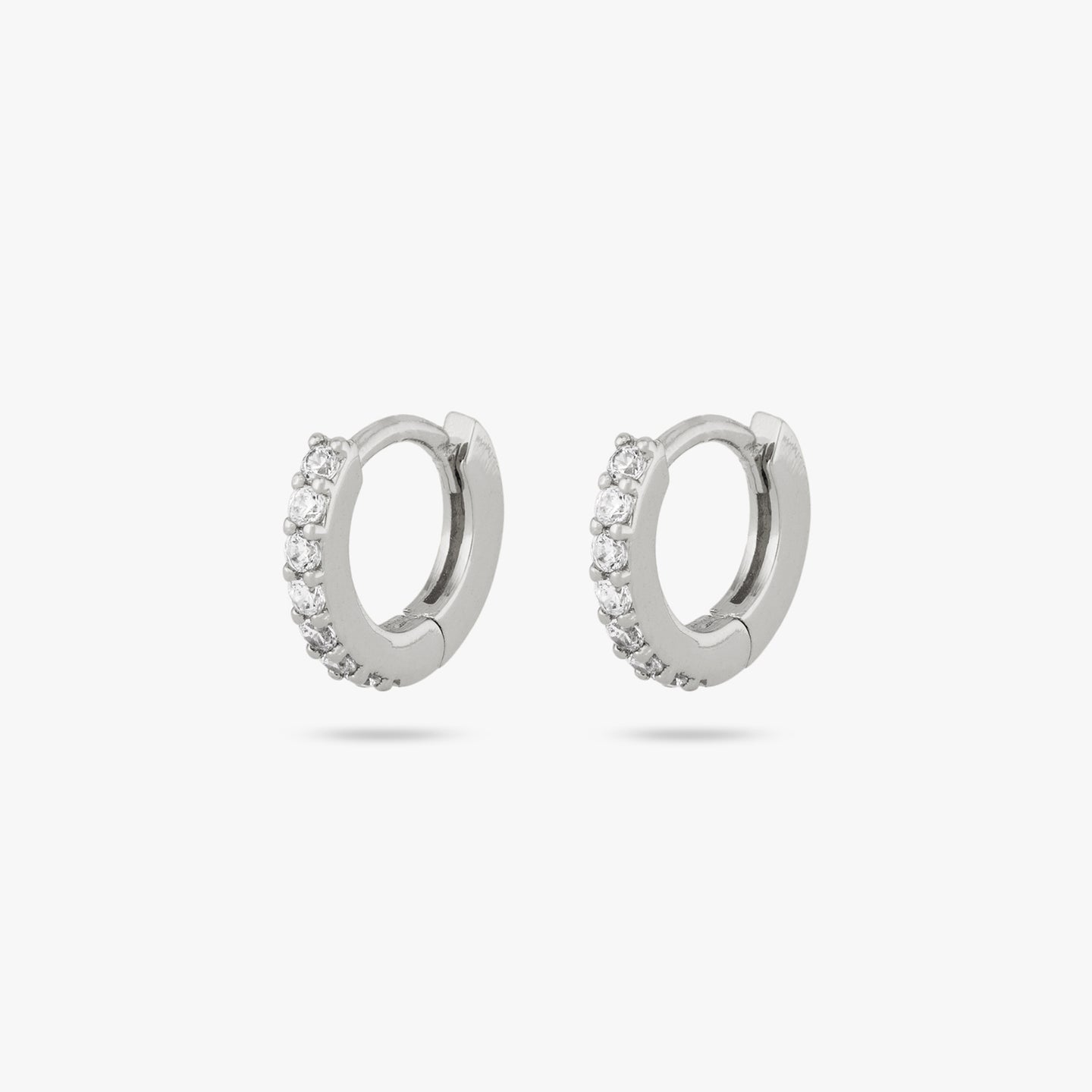 A pair of silver/clear micro pave huggies with a 6mm inner diameter [pair] color:null|silver/clear