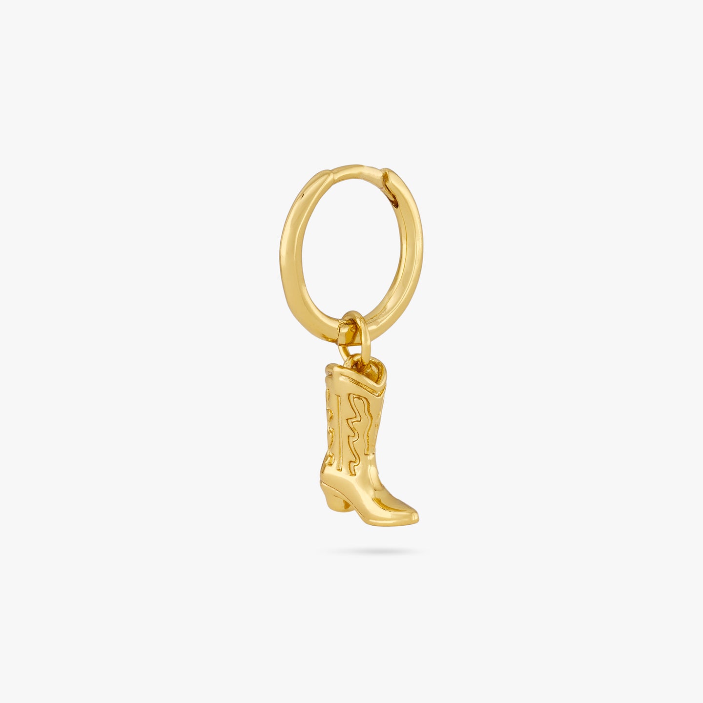 This is a gold cowboy boot charm dangling from a gold huggie color:null|gold