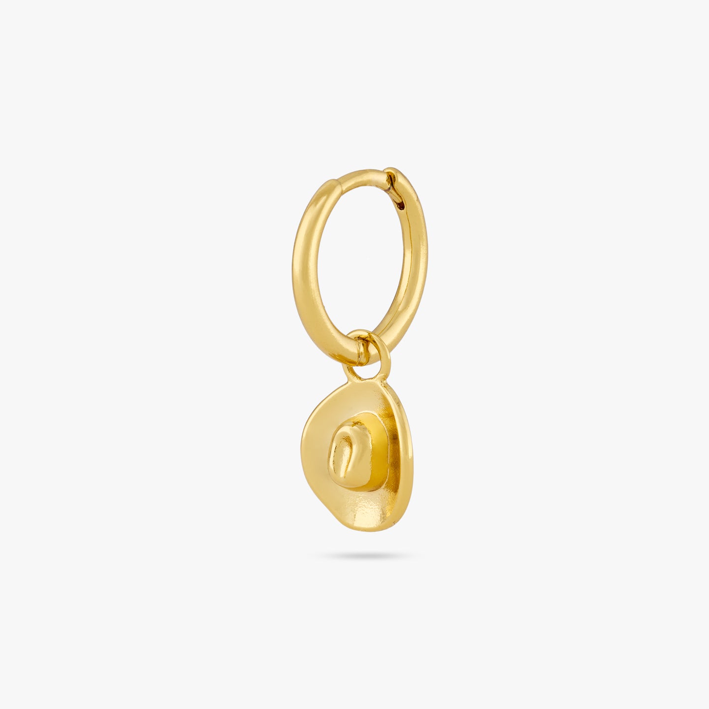 A small gold huggie with a cowboy hat charm on an ear. color:null|gold