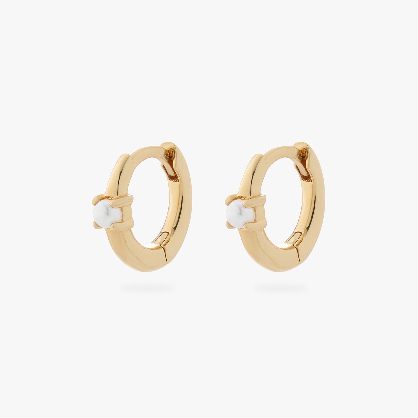 a pair of gold small huggies with pearl accent stones [pair] color:null|gold