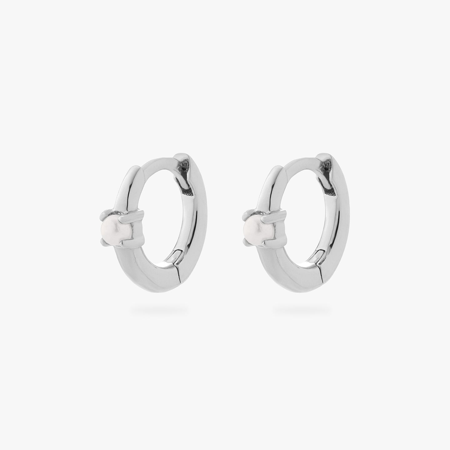 a pair of silver small huggies with pearl accent stones [pair] color:null|silver