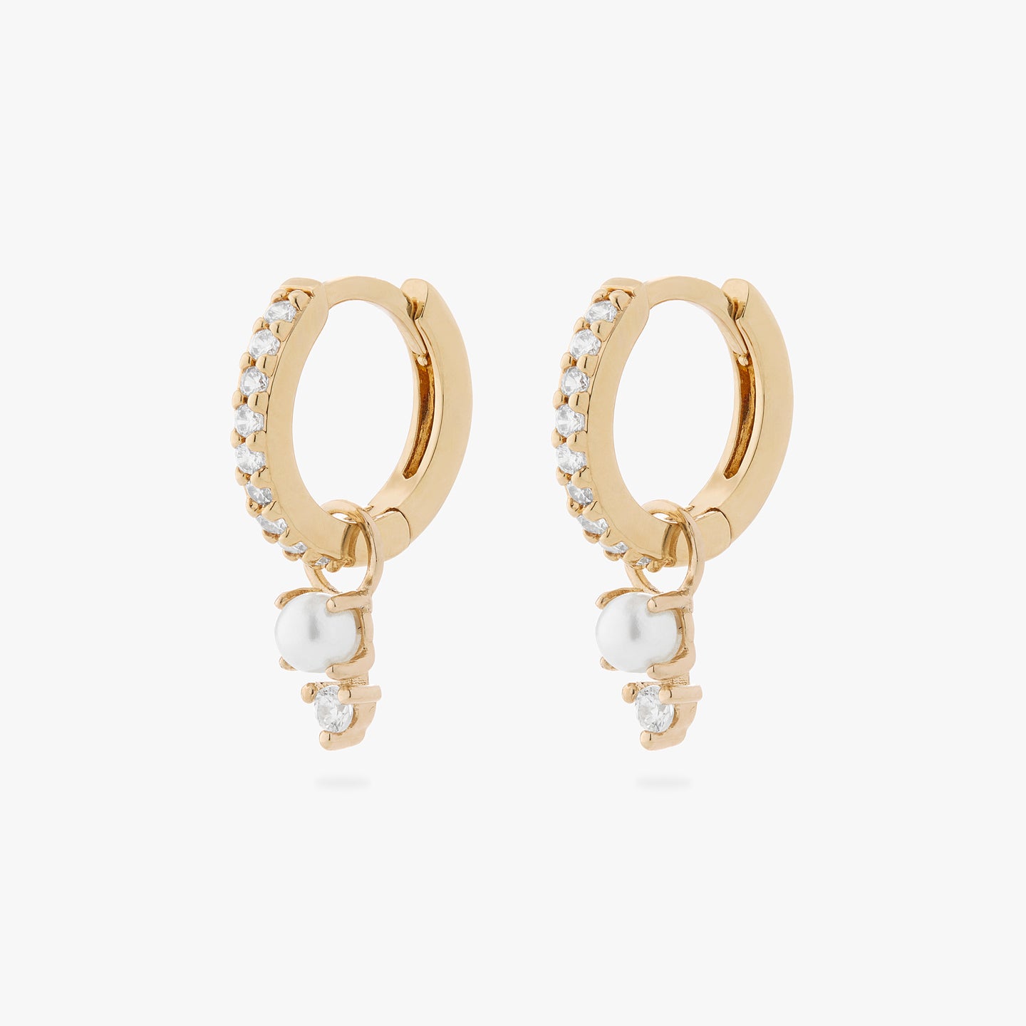 a pair of mini pave huggies in gold/clear with charms that have a stacked pearl and clear cz [pair] color:null|gold/pearl