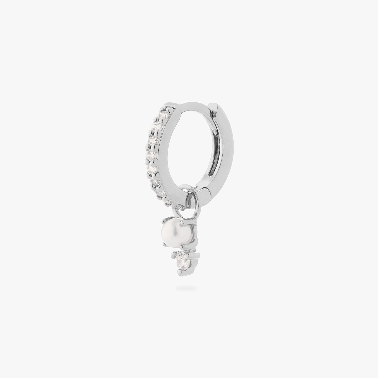 a mini pave huggie in silver/clear with a charm that has a stacked pearl and clear cz color:null|silver/pearl