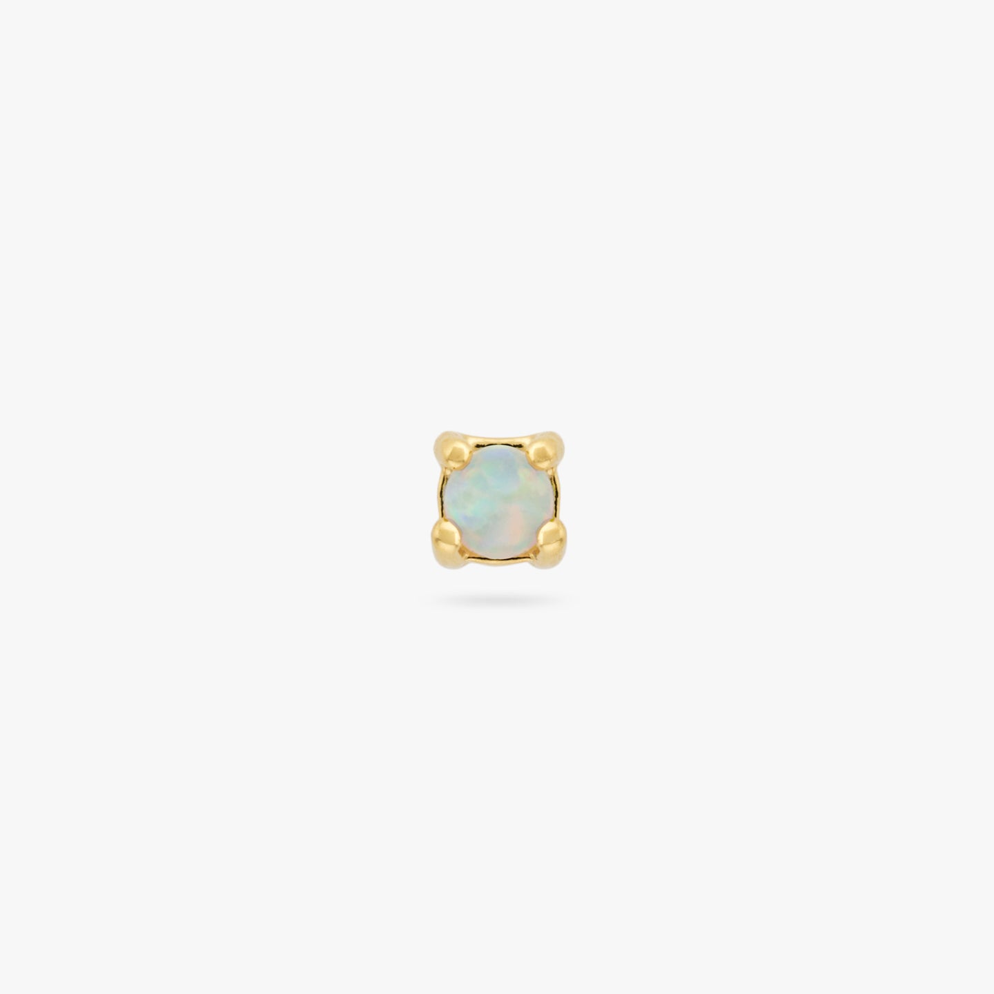 This is a small gold stud with an opal color:null|gold/opal