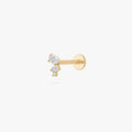 This image shows a 14k yellow gold pear cluster flatback with three clear cz stones 