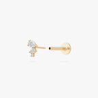 This image shows the side view of a 14k yellow gold pear cluster flatback with three clear cz stones separated from labret