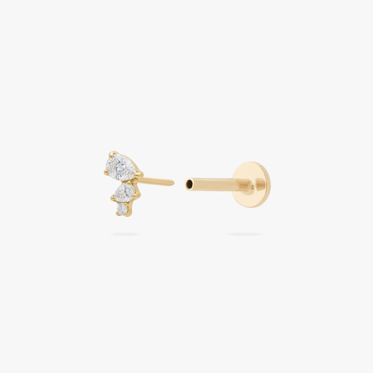 This image shows the side view of a 14k yellow gold pear cluster flatback with three clear cz stones separated from labret