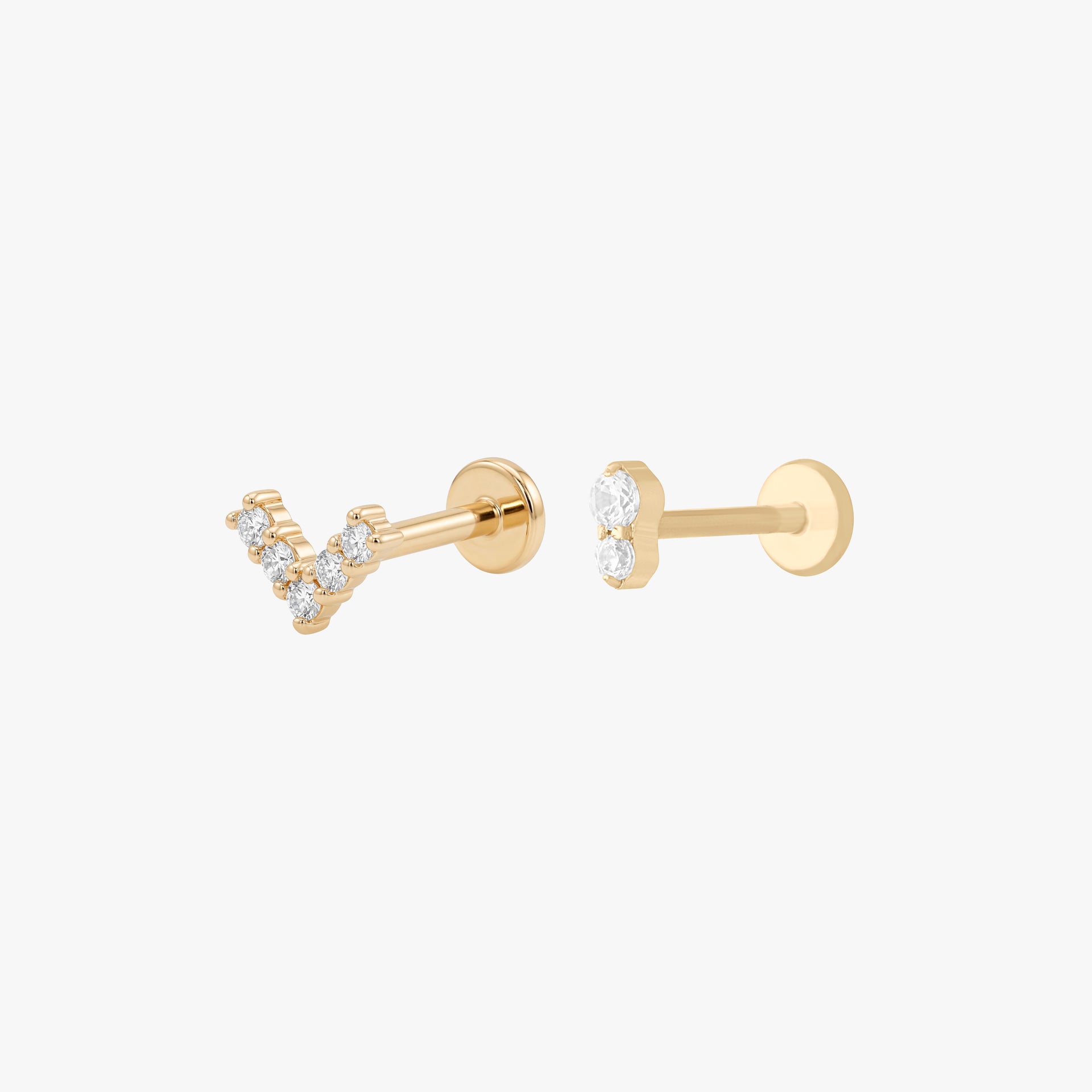 This image shows a 14k Yellow Gold stud set. The set includes a Gold V flatback stud with clear cz stones and a Gold stacked stud with two clear cz stones.