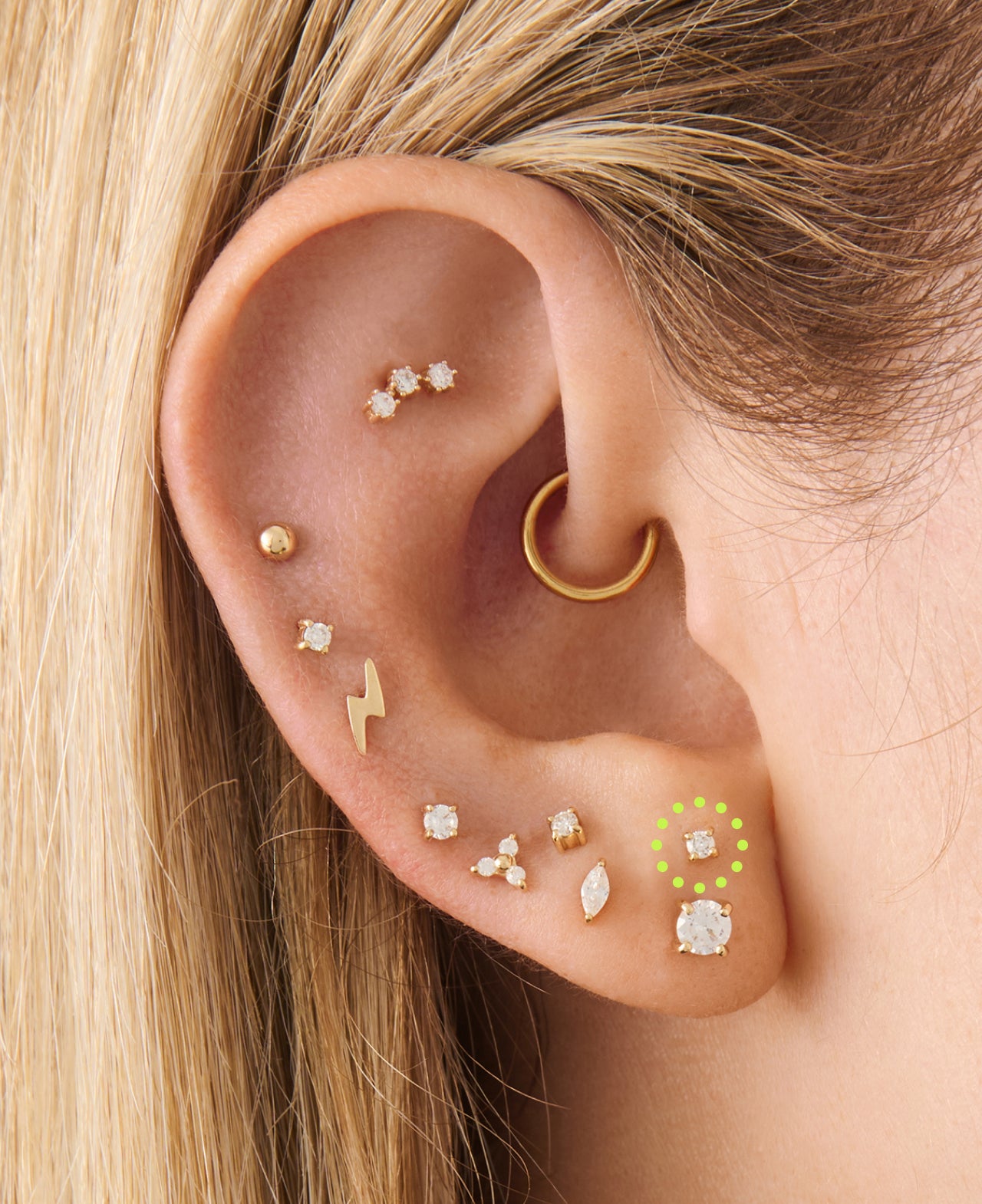 Ear styled with Studs earrings with an indicator the stacked lobe placement