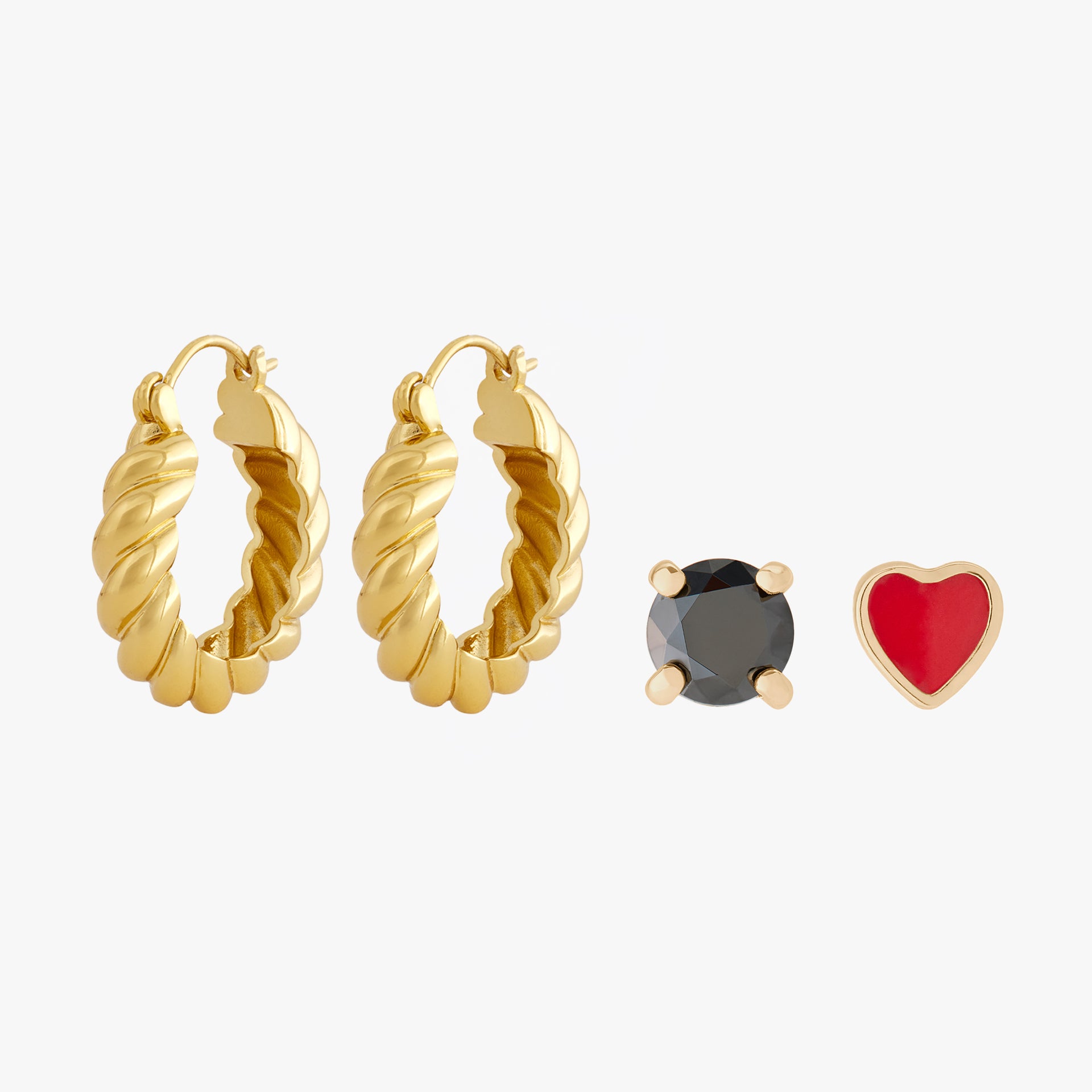 Set with a pair of chunky gold hoop earrings, a 14K 4mm black stone flatback, and a 14K red enamel heart flatback