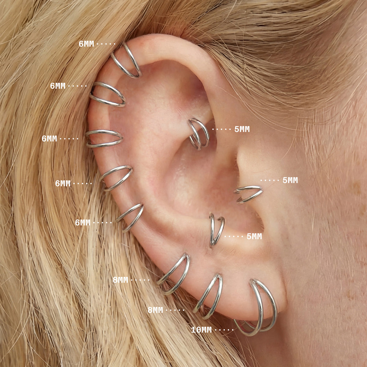 On ear image with all silver double clicker sizes highlighting sizes 5mm to 10mm