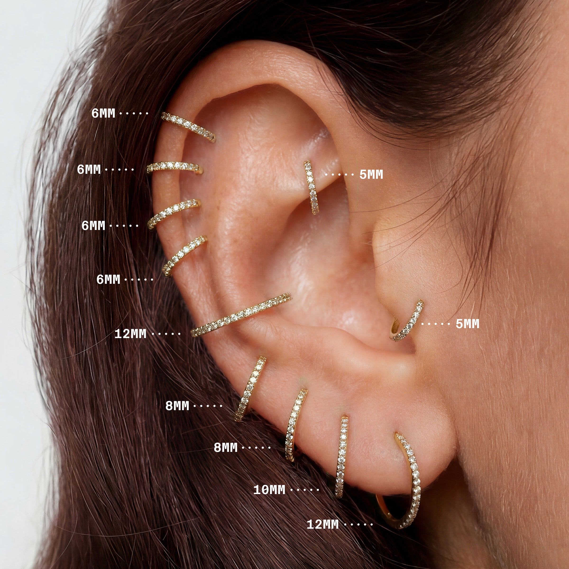 On ear image with all sizes of gold pave clickers highlighting the sizes from 5mm to 12mm - Alternative view 3