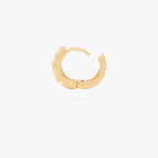 this image shows the profile view of a 14k gold plated huggie with three green circular cz stones