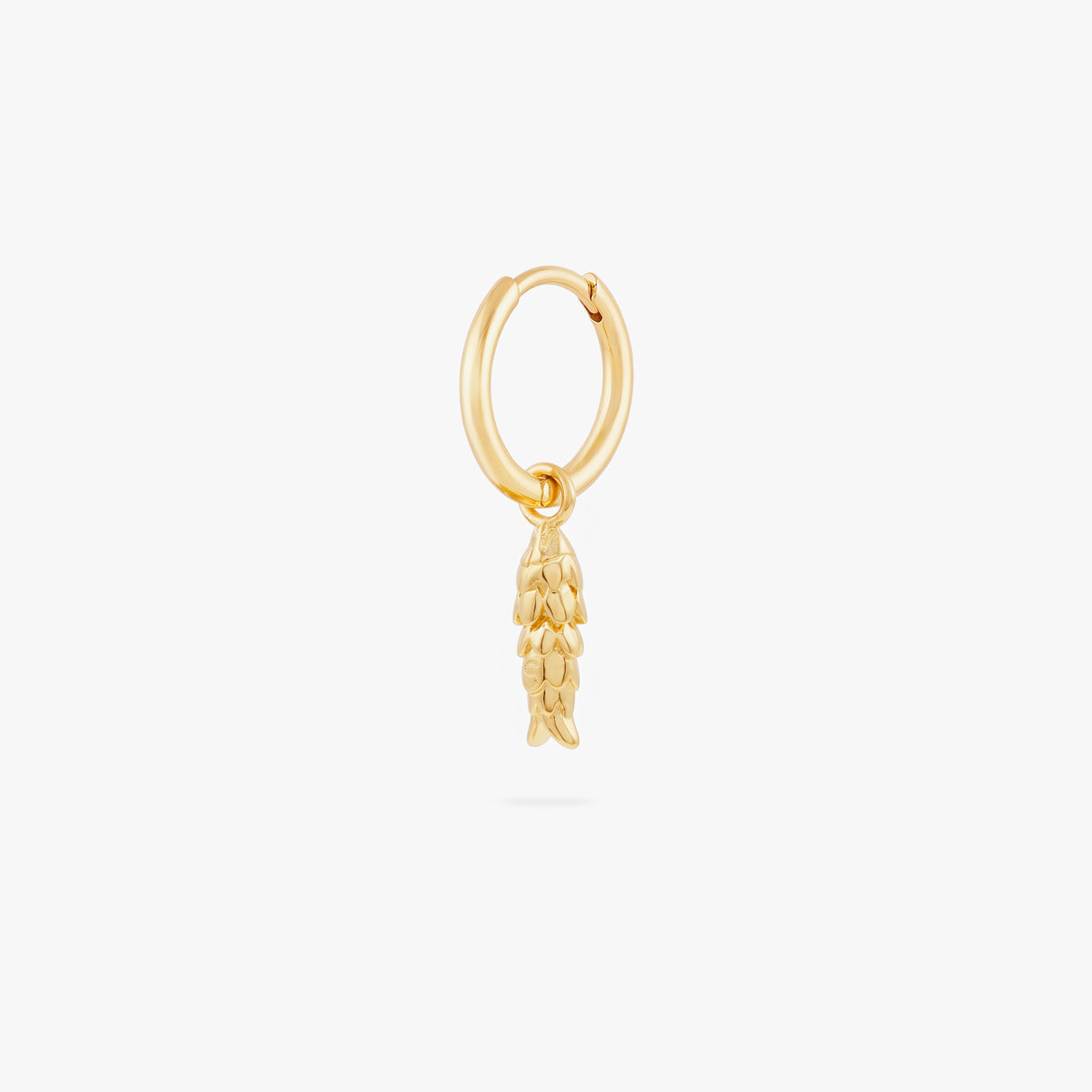 This image shows a 14k gold plated huggie with a dangling fish charm 