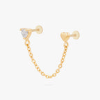 Anodized titanium gold chain connector earring flat back featuring a heart CZ stud and another heart stud linked by a delicate gold chain.
