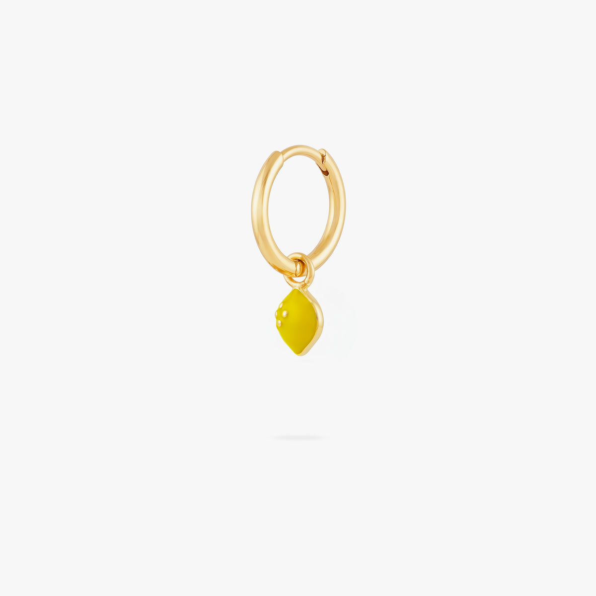 This image shows a 14k gold plated huggie with a yellow lemon charm. 