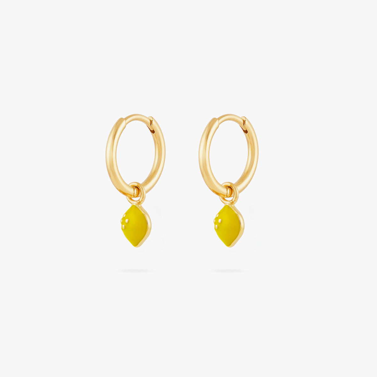 This image shows a  pair of 14k gold plated huggies with yellow lemon charms. 