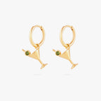 this image shows a pair of 14k gold plated huggies with  martini glass charms with a green gemstones.