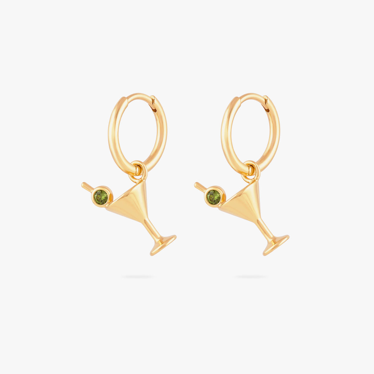 this image shows a pair of 14k gold plated huggies with  martini glass charms with a green gemstones.