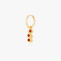 this image shows a 14k gold plated huggie with three olives with a red stone in the middle of each olive. 
