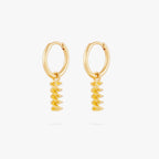 This image shows a pair 14k gold plated huggies with twisted pasta charms. 