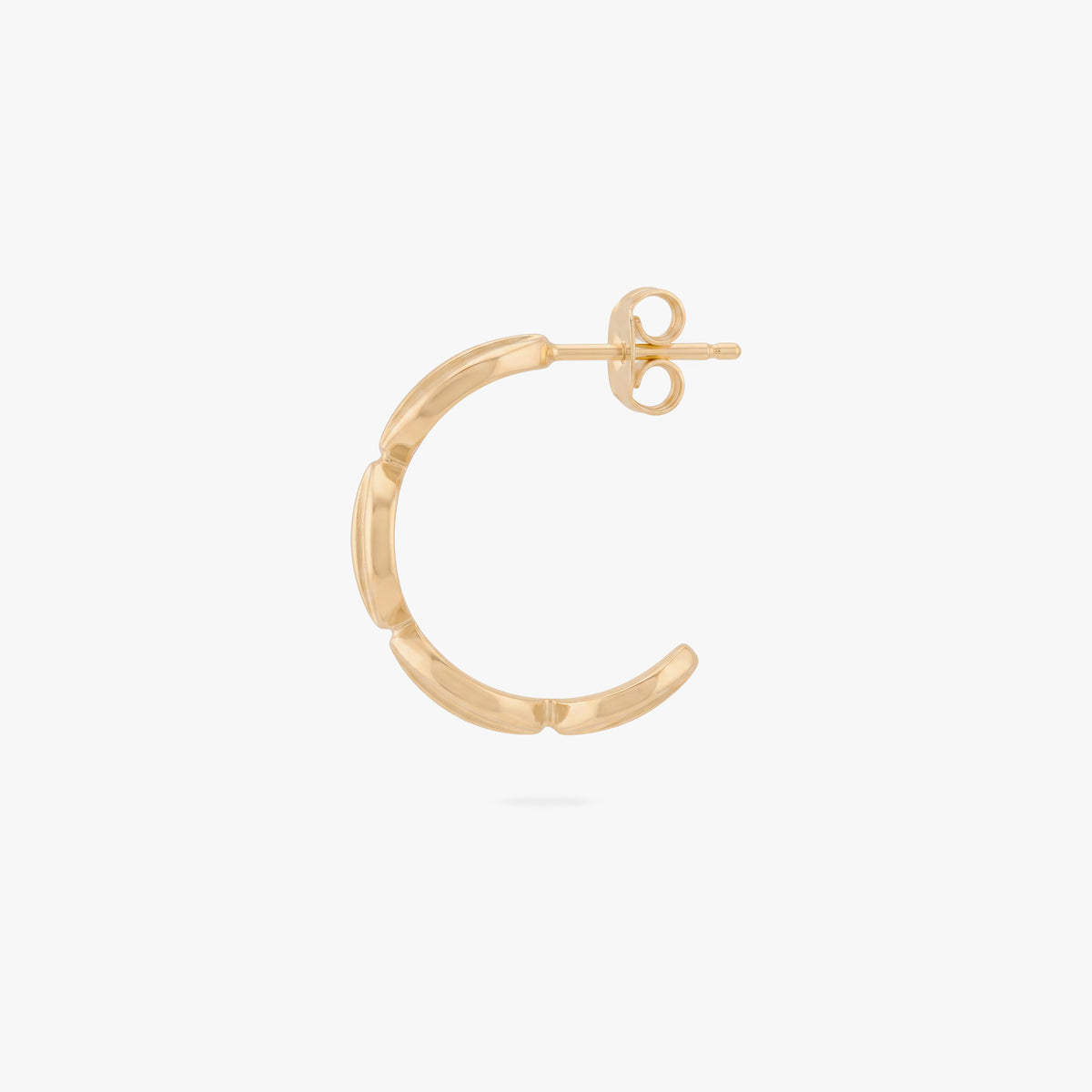 This image shows the profile view of a 14k gold plated hoop with spirals along the front 