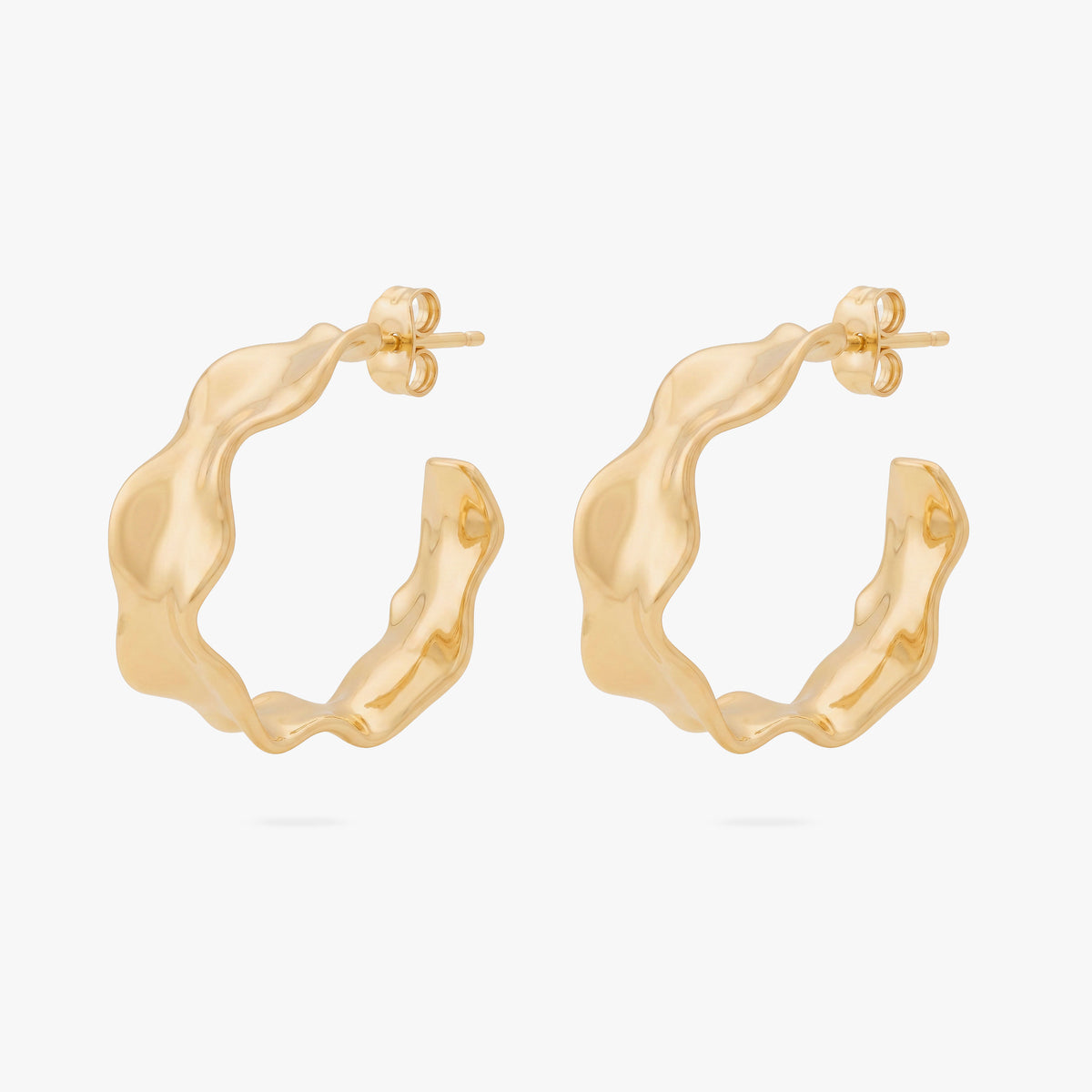 This image shows the front view of a pair of 14k gold plated hoops with an organic shapes around the hoop 
