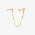 This image shows a titanium gold chain connector earring featuring a circular CZ flatback stud and a circular clear cz stud flatback linked by a delicate gold chain. This is the back image. 