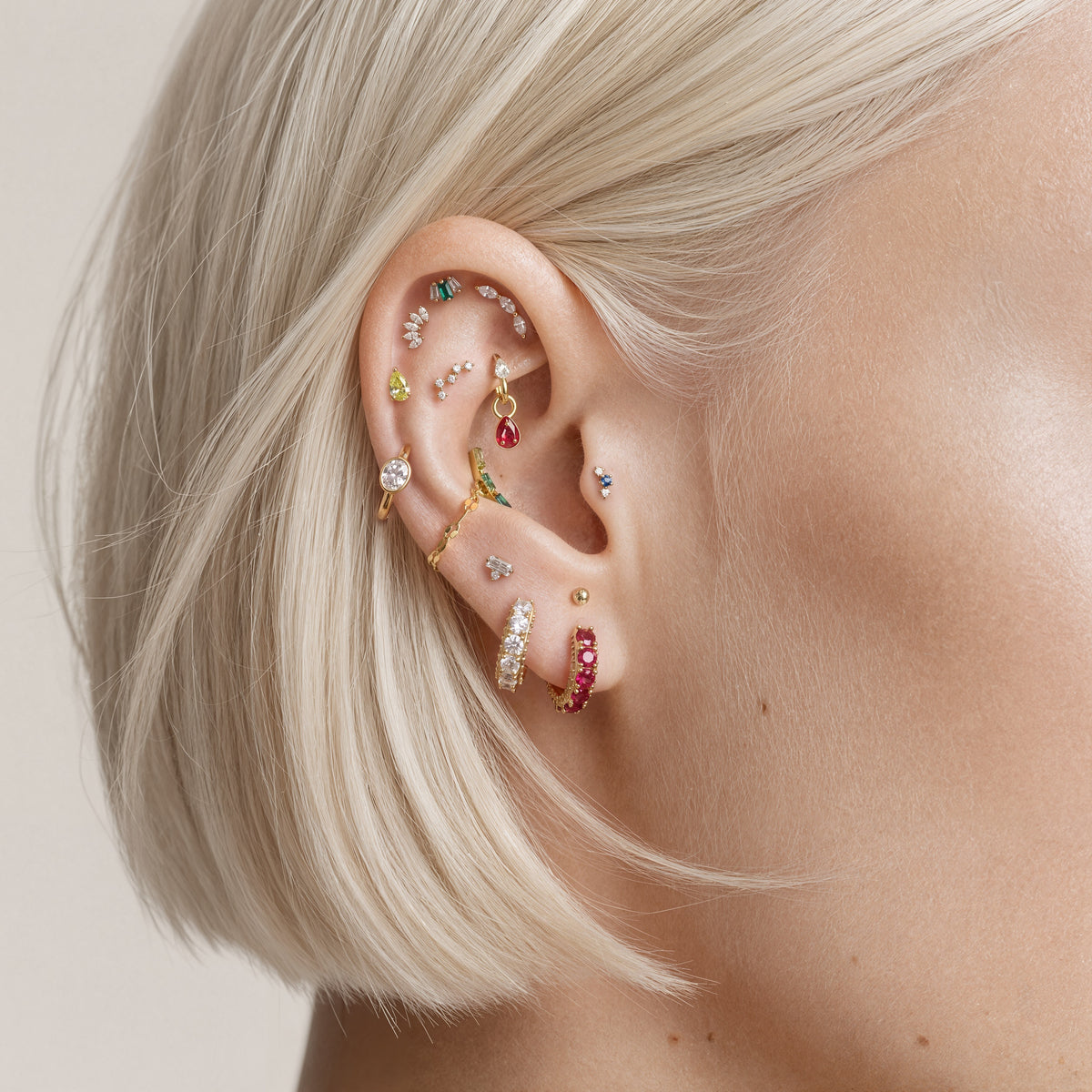 this image shows an earscape featuring the max pave huggie with clear cz stones.