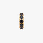 this image shows the front view of the max pave huggie with black cz stones along the front and clear along the side of the huggie 