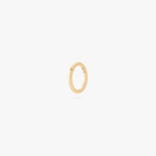 This is an image of a gold-toned titanium clicker with a 5mm diameter and a hinge closure. 