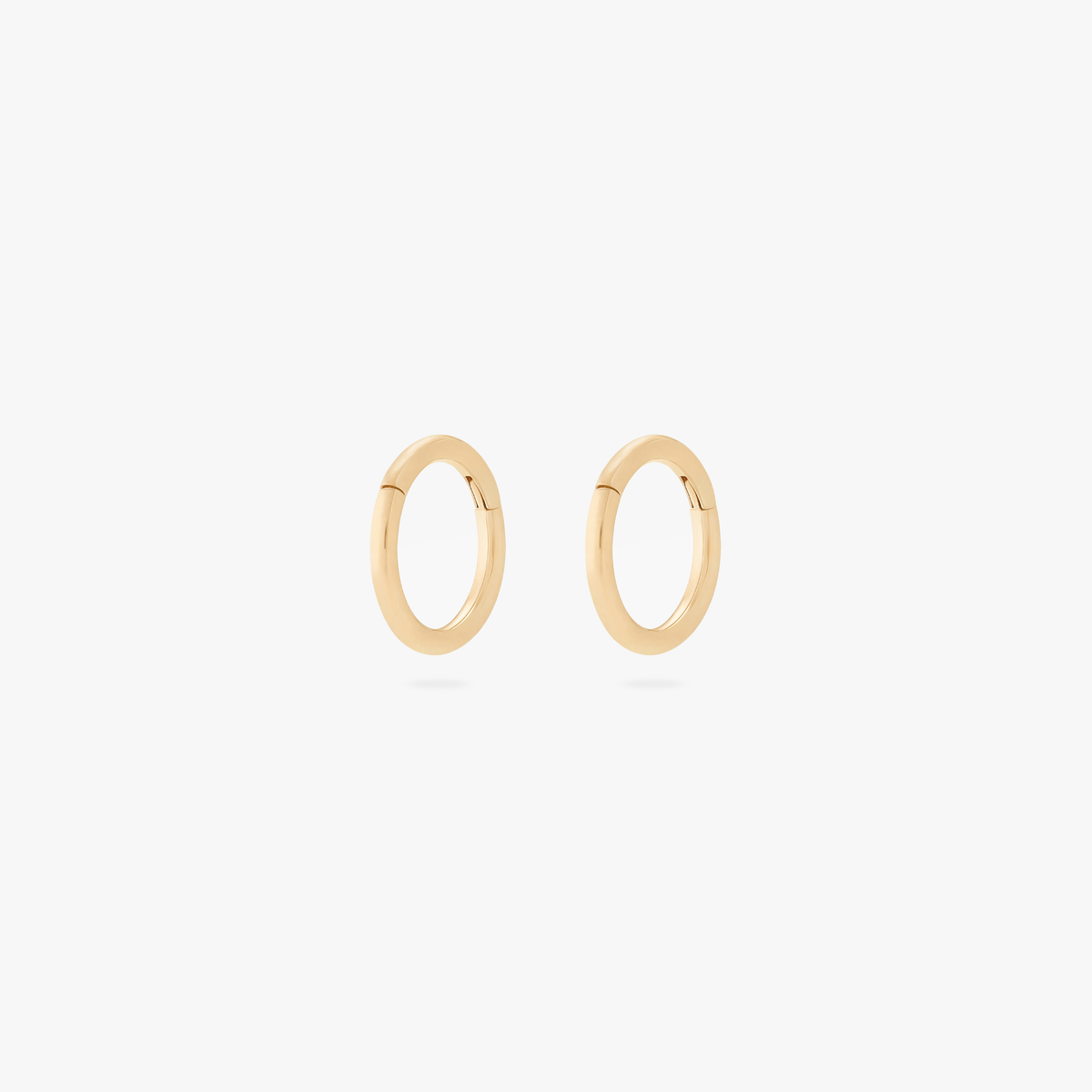 Pair of gold 5mm clickers on a white background