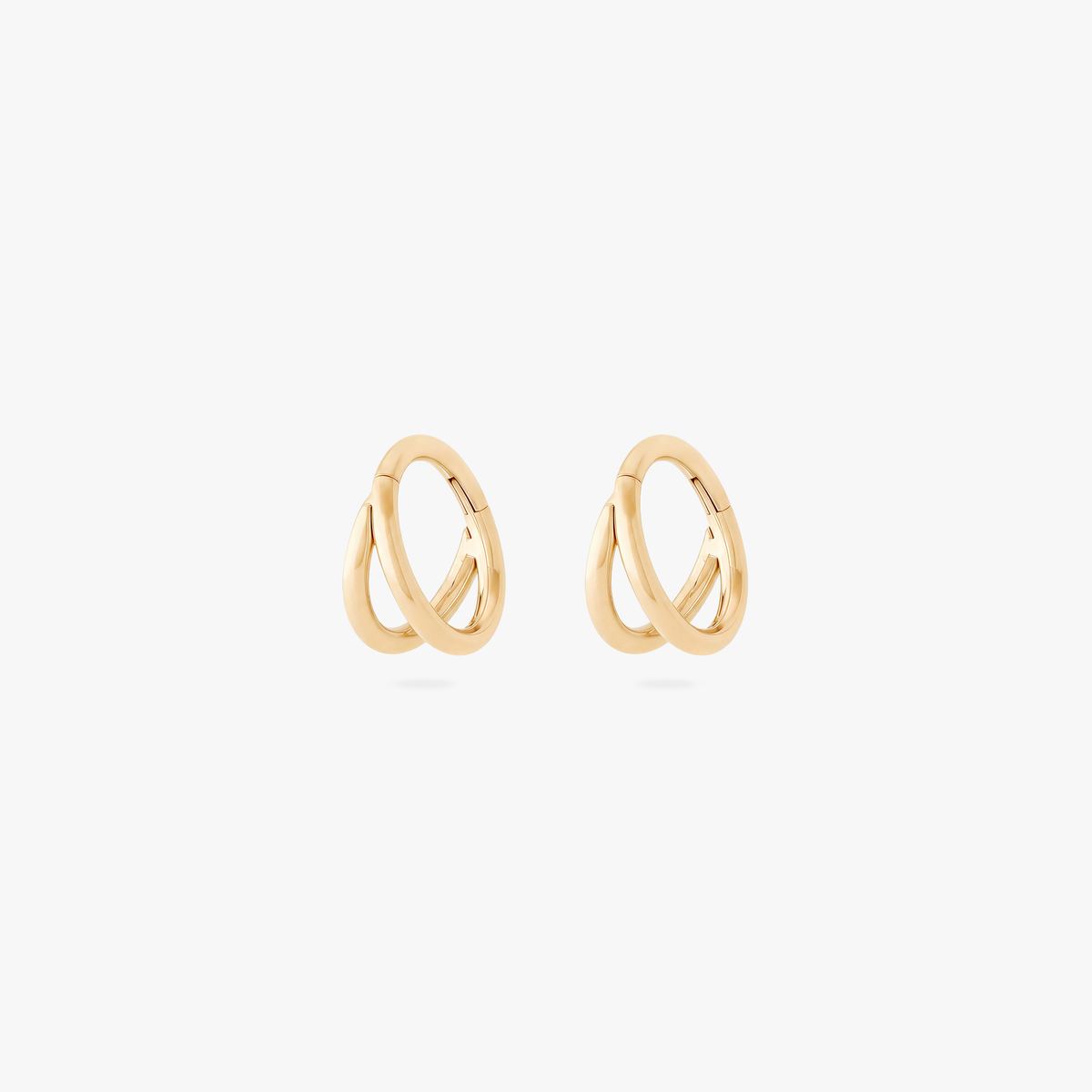 Pair of 5mm gold double clickers on a white bakground