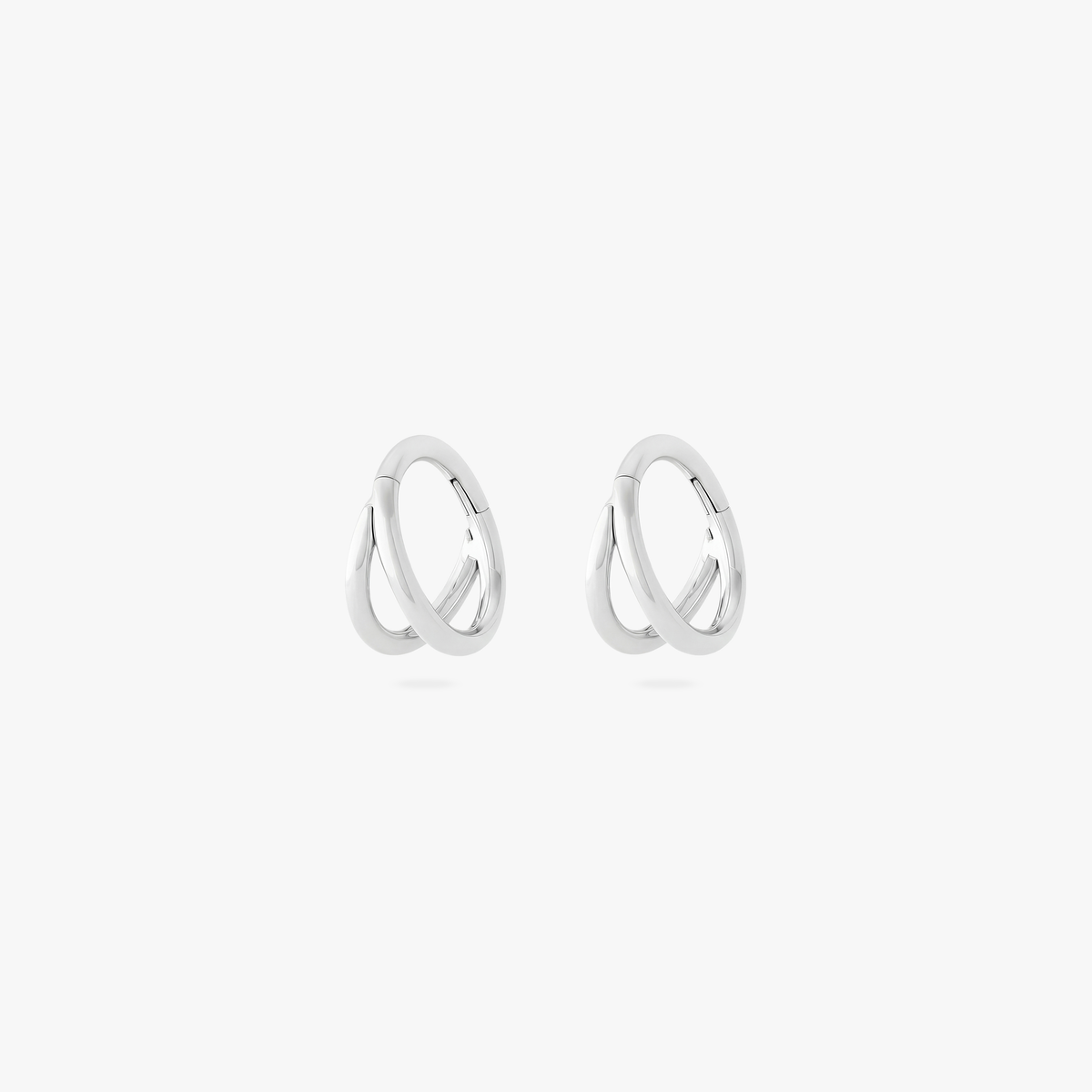 Pair of silver 5mm double clickers on a white bakground